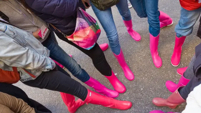 Botas rosas de socias PBS